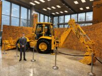 William Jones stood in front of Million Backhoe